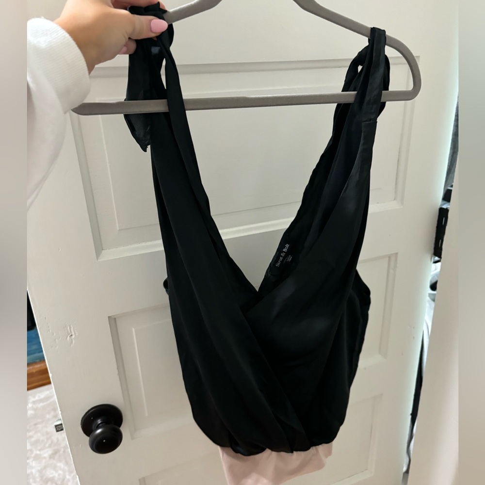 Strut and bold black body suit